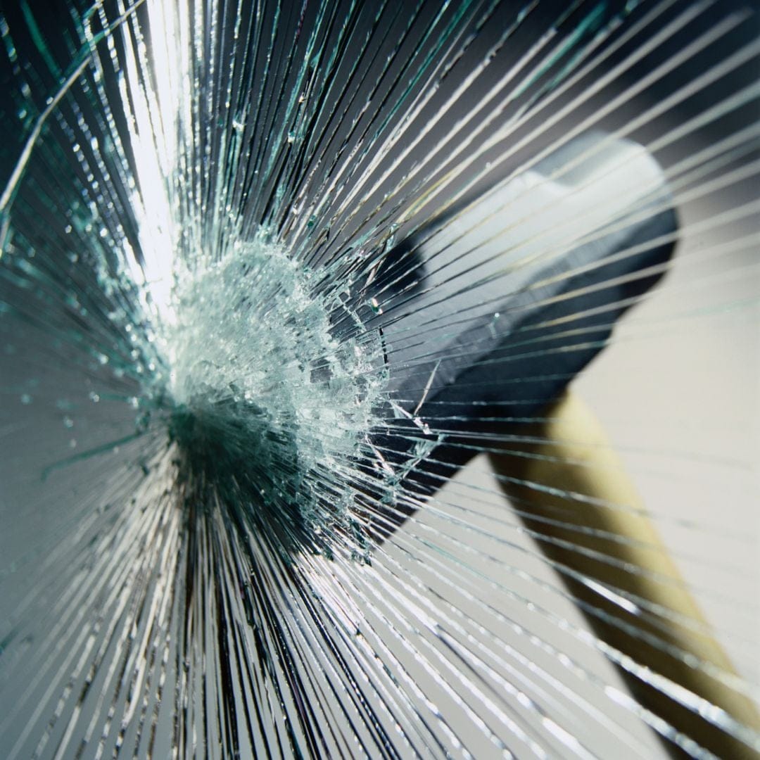a sledgehammer breaking glass
