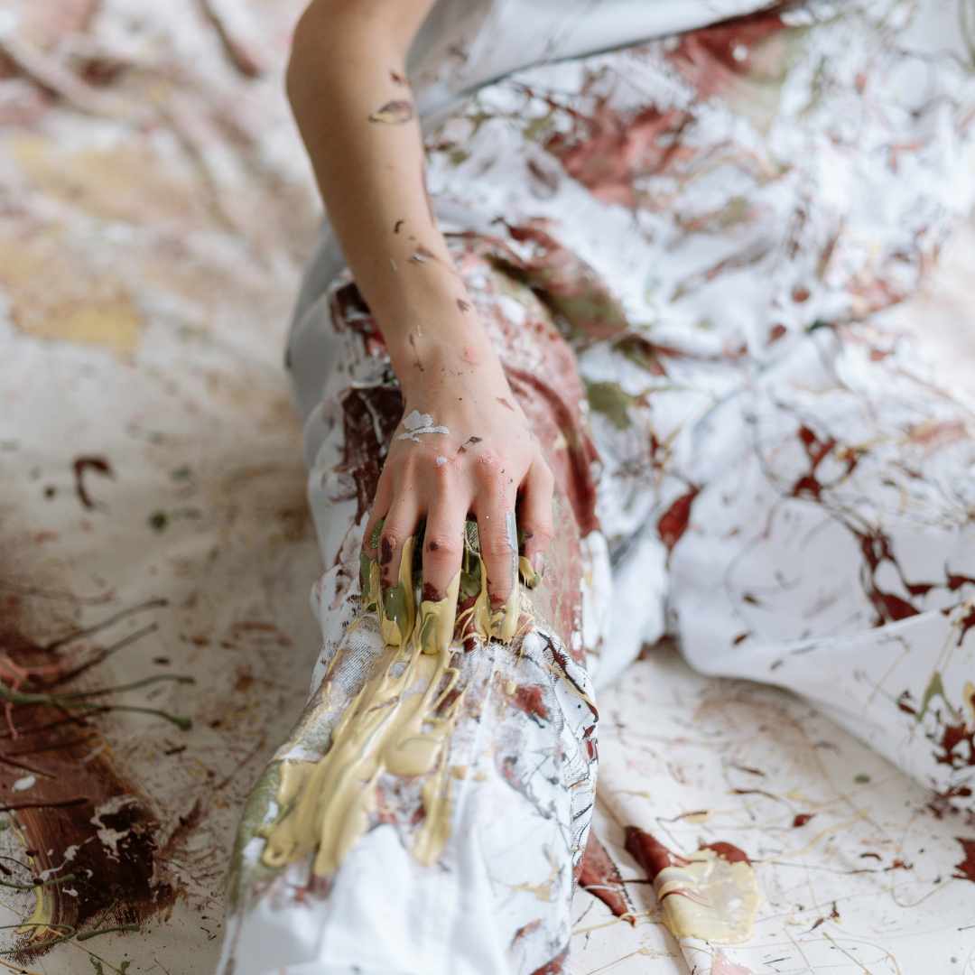 Splatter paint on cover-alls.