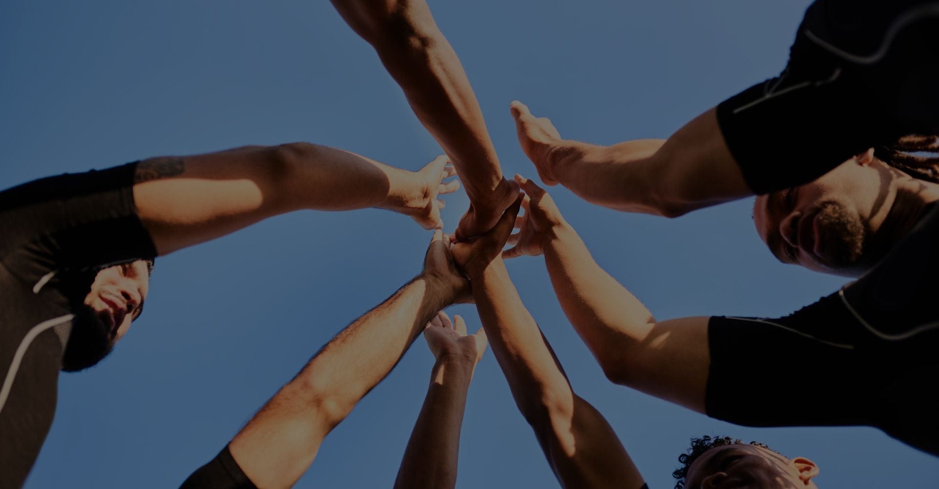 Team raising hands together