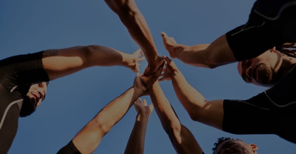 Team raising hands together